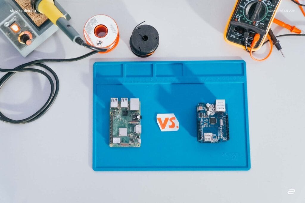 arduino vs raspberry pi: Side-by-side setup of an Arduino Uno and Raspberry Pi board with tools in the background, illustrating the differences in functionality and use cases between microcontrollers and single-board computers.
