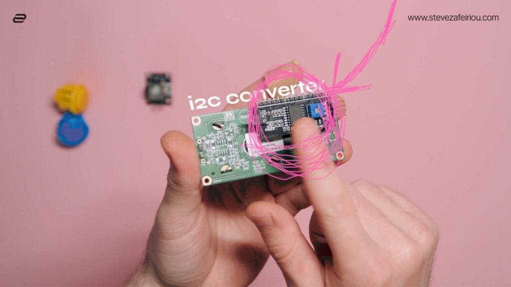 Close-up of a 16x2 LCD display with an attached I2C converter module, essential for Arduino-based DIY electronics projects.