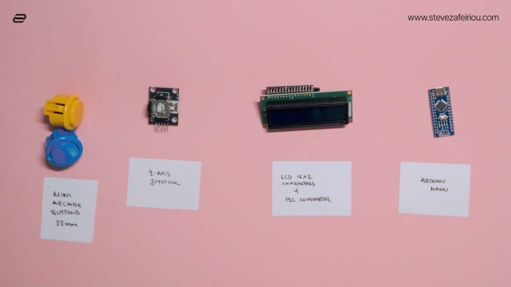 Electronic components laid out including mini arcade buttons, 2-axis joystick, 16x2 LCD screen with I2C converter, and an Arduino Nano board, ready for assembling a DIY arcade console.