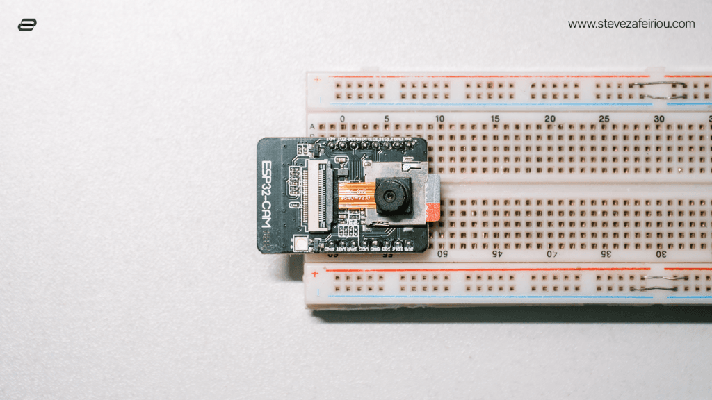 Top-down view of an ESP32-CAM board connected to a breadboard, ideal for DIY electronics projects and embedded camera applications.