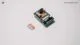 ESP32-CAM development board positioned next to a SanDisk MicroSD memory card, illustrating data storage compatibility.