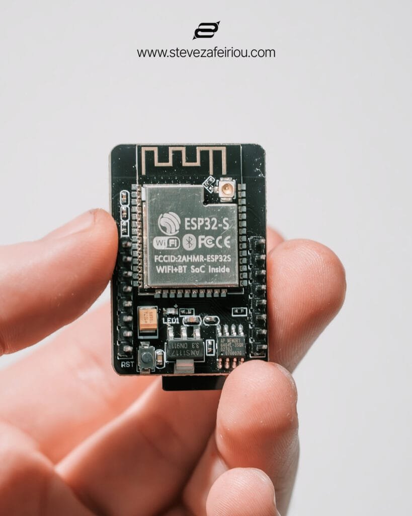 Close-up image of an ESP32-S WiFi and Bluetooth-enabled microcontroller chip from an ESP32-CAM module, ideal for embedded IoT solutions.
