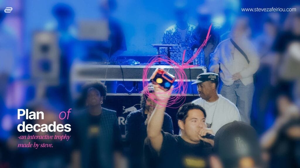 A DIY Arduino nano arcade console: Event host showcasing a custom-made interactive arcade console trophy designed by Steve at the 'Plan of Decades' dance battle event, highlighting its colorful arcade buttons and unique 3D-printed design.